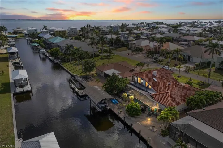 Ten-thousand-pound boat lift that is canopied and still has plenty of room to add a second dock if wanted. Easy access to the water and a sparkling pool and spa to relax and enjoy in!