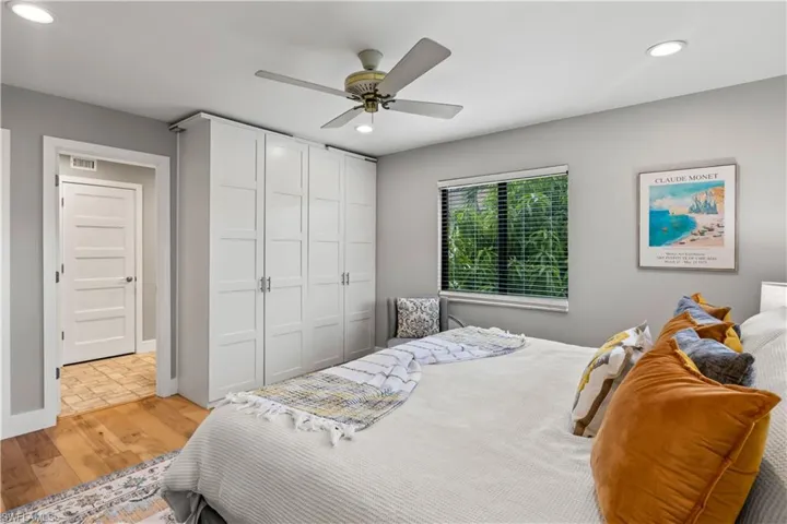 Cozy guest bedroom with soft natural light, neutral tones, and ample space for comfort. A welcoming retreat for visitors with a peaceful, restful atmosphere