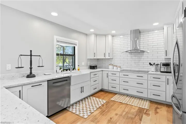 The spacious kitchen boasts ample counter space, modern appliances, and an open layout perfect for cooking, entertaining, and gathering with family.