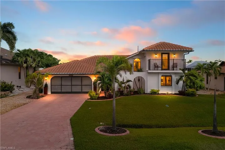 Mediterranean style custom home with large driveway and all kinds of extras you will notice everywhere! Enjoy working in your screened garage - no pesky bugs!!