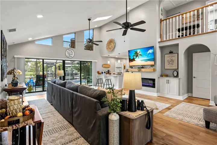 So much charm -gorgeous double heavy wood doors that make a statement! Beautiful staircase, lots of wall space for art display - an electric fireplace for ambience! It's all in the details!