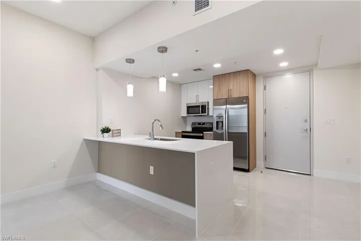 A stunning contemporary kitchen featuring sleek quartz countertops