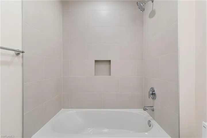 Guest bathroom featuring full bathtub