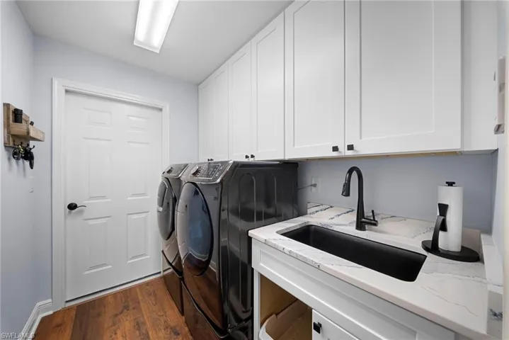 Laundry room featuring independent washer and dryer