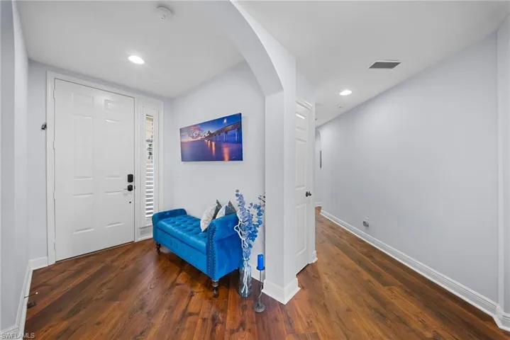 Entryway featuring arched walkways