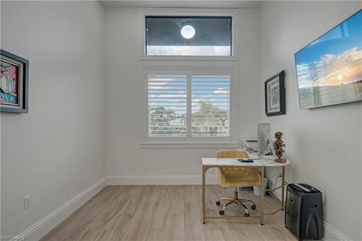 Office space featuring light wood finished floors and baseboards