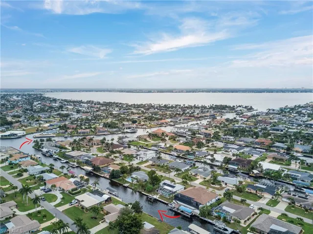 View of property location featuring nearby suburban area and a large body of water