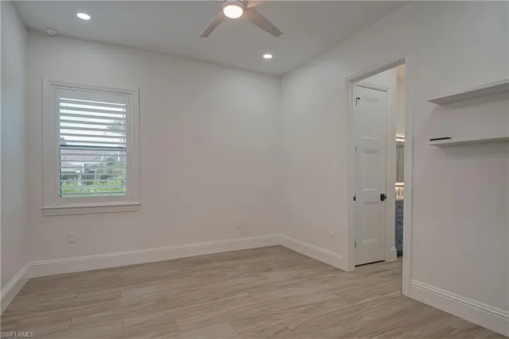 Empty room with light wood-style flooring, recessed lighting, and ceiling fan