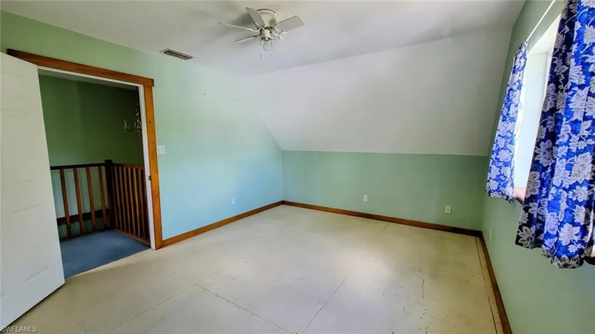Bonus room featuring lofted ceiling and ceiling fan