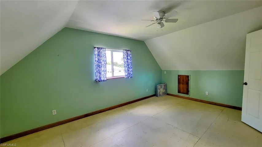 Bonus room featuring lofted ceiling and ceiling fan