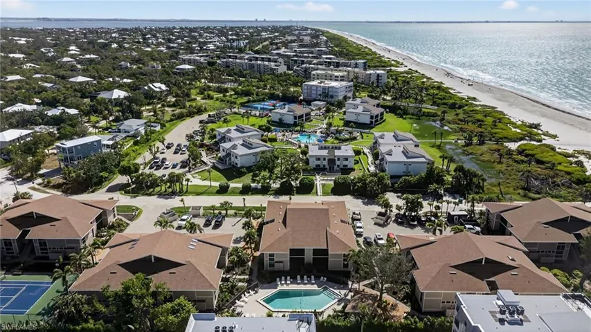 Aerial view of unending shoreline and a pool