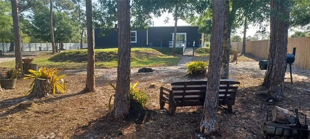 View of yard featuring fence