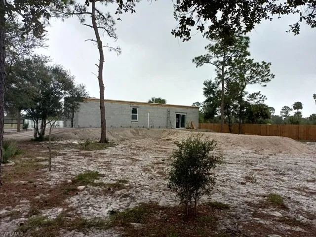 Rear view of house with fence