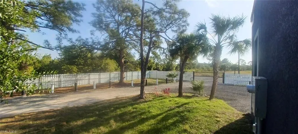 View of yard featuring fence