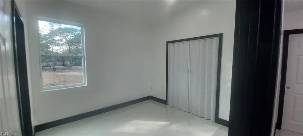 Unfurnished bedroom featuring a closet