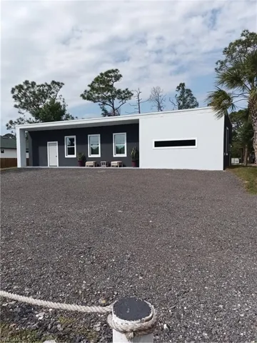 View of front of house with stucco siding