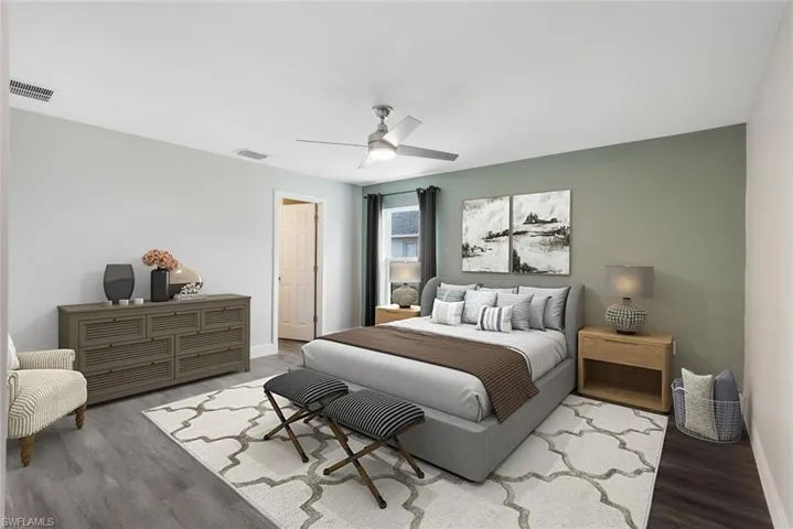 Bedroom featuring hardwood / wood-style flooring and ceiling fan
