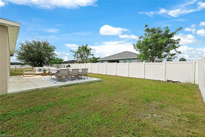 View of yard with an outdoor hangout area and a patio