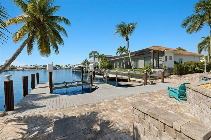 Dock with boat lift and a water view
