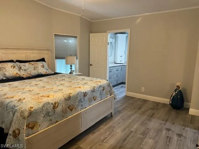 Bedroom featuring ensuite bathroom, crown molding, King Bed
