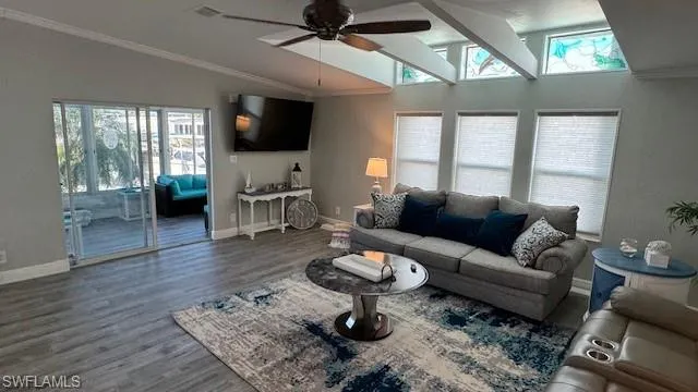 Living room with walk out to waterfront lanai and a wealth of natural light