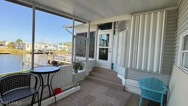 screened in lanai with a water view