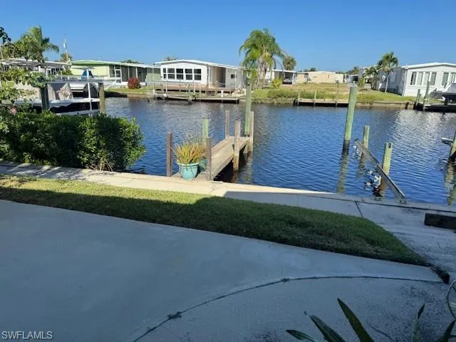 Nice patio with View of dock featuring a water view