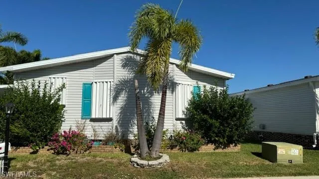 Front of home.  Nice locking hurricane shutters around the entire house with easy closing/locking.