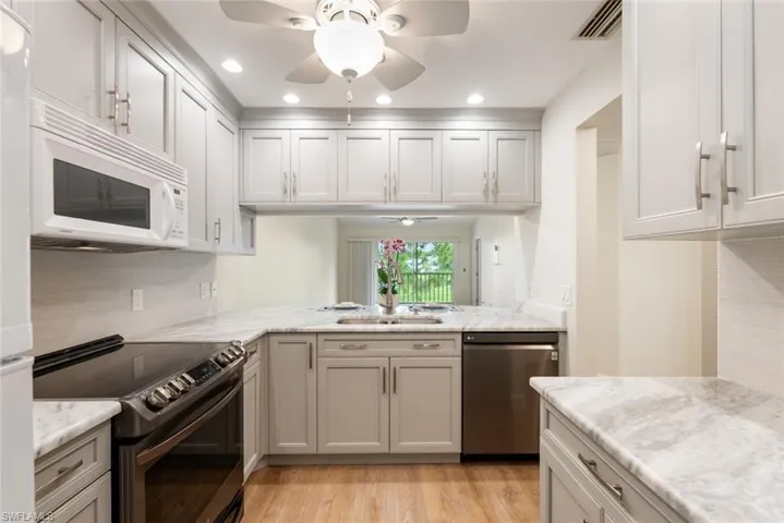 Remodeled Kitchen with Granite Countertops and Stylish Cabinetry