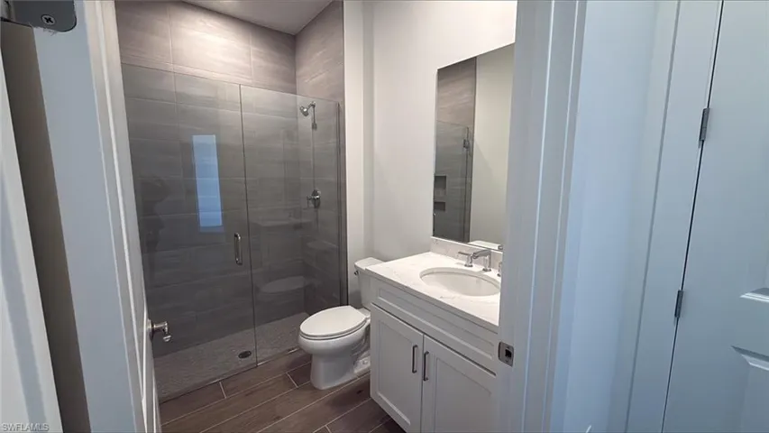 Guest bathroom with full walk-in shower and vanity