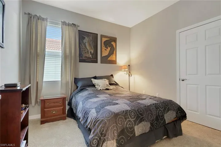 Bedroom with light carpet