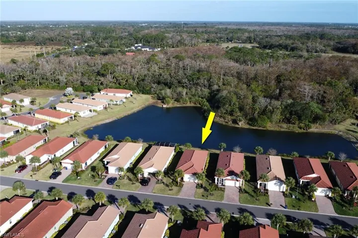 Aerial overview of property's location with a nearby body of water and nearby suburban area