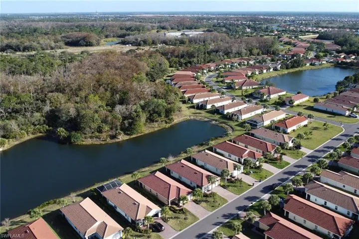 View of property location with a nearby body of water and nearby suburban area