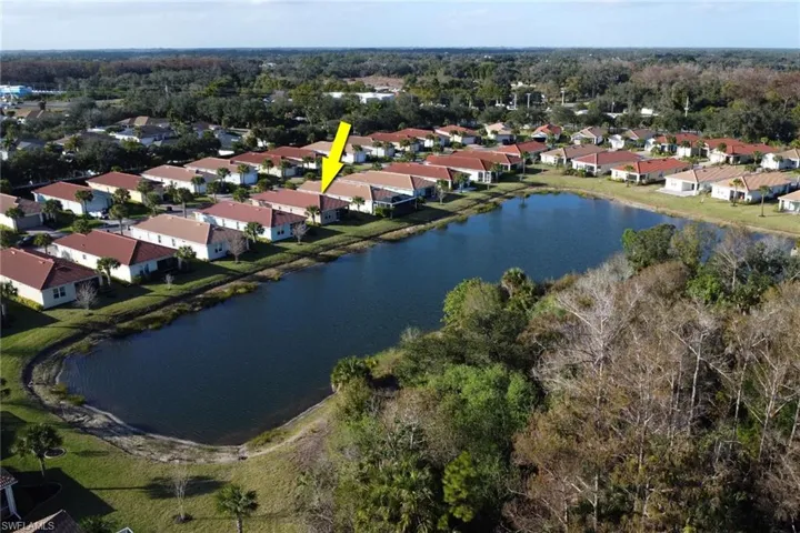 View of property location featuring a large body of water and nearby suburban area