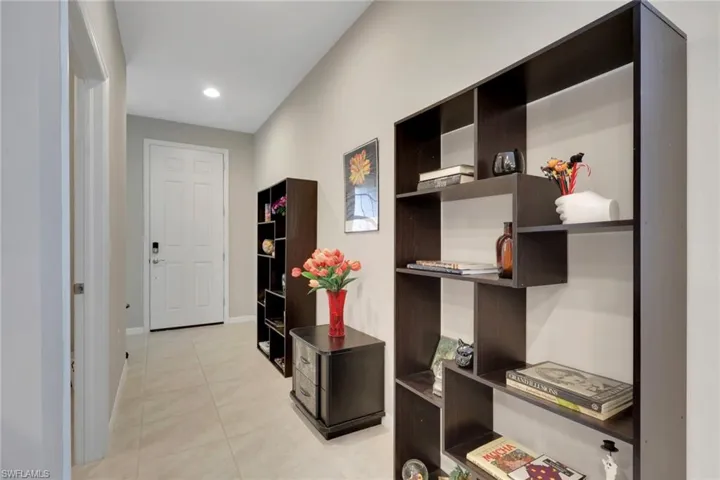 Office featuring light tile patterned flooring and recessed lighting