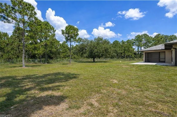 View of yard featuring a sunroom