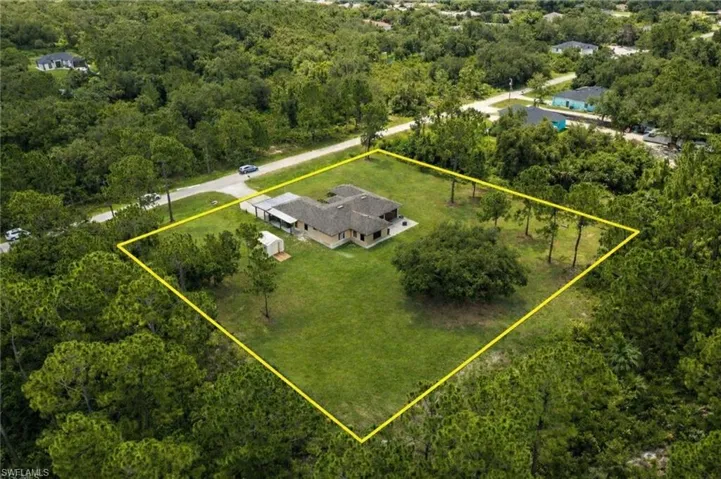 View of subject property featuring property boundaries highlighted and a forest