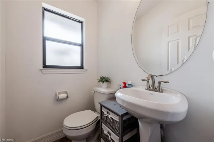Bathroom with toilet and baseboards