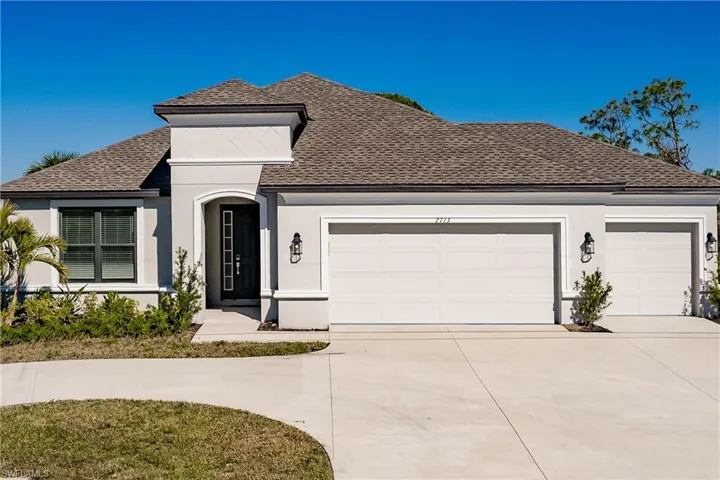 Look close to see the details that set this home apart from the others.  Decorative foam crown moldings and molding around the windows entryway and garage doors and its landscaped like a model.