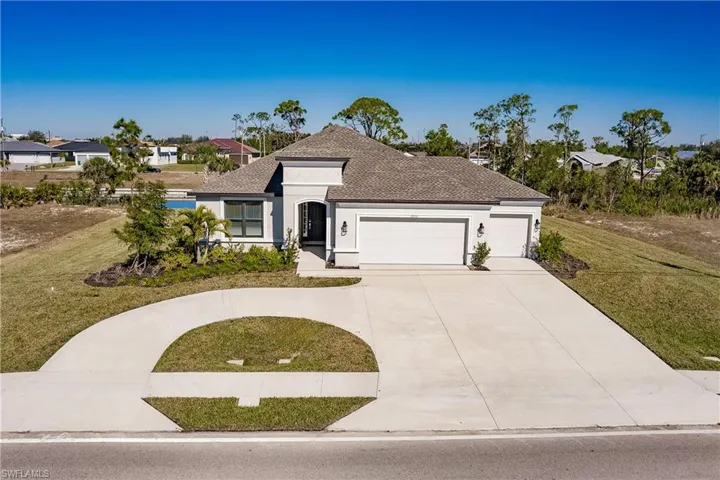 This brand new home has great curb appeal and a Huge triple lot with 3 car garage and circular driveway! There is approx. 33 ft of side yard on each side of the home.  No close neighbors here!