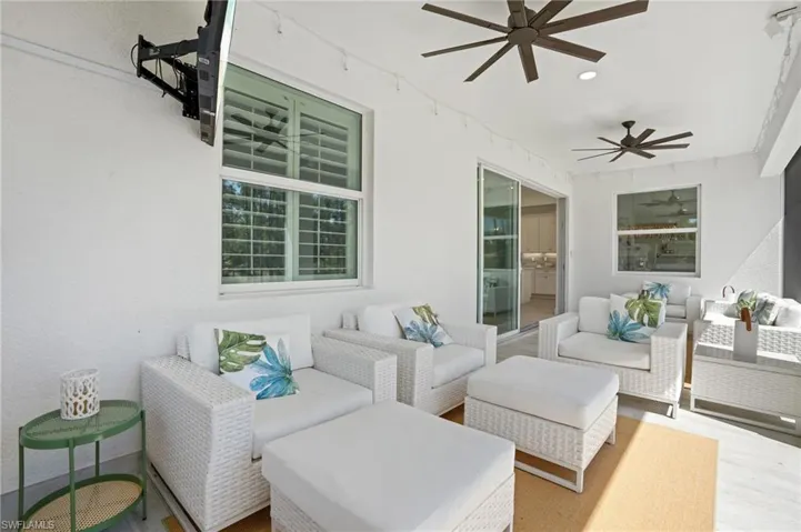 View of patio / terrace with ceiling fan and an outdoor living space