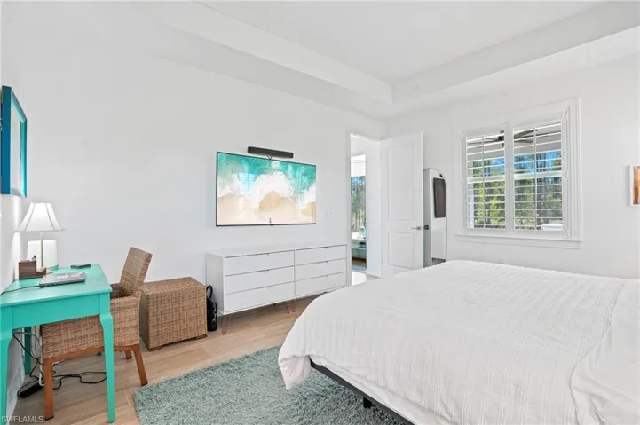Bedroom with light wood-style floors