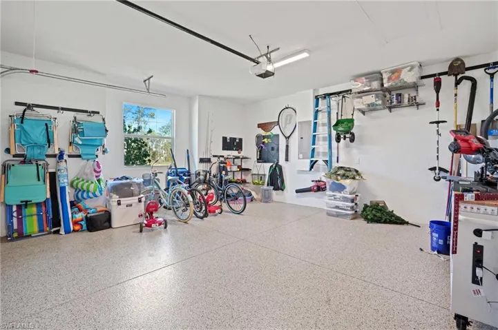 Garage featuring a garage door opener
