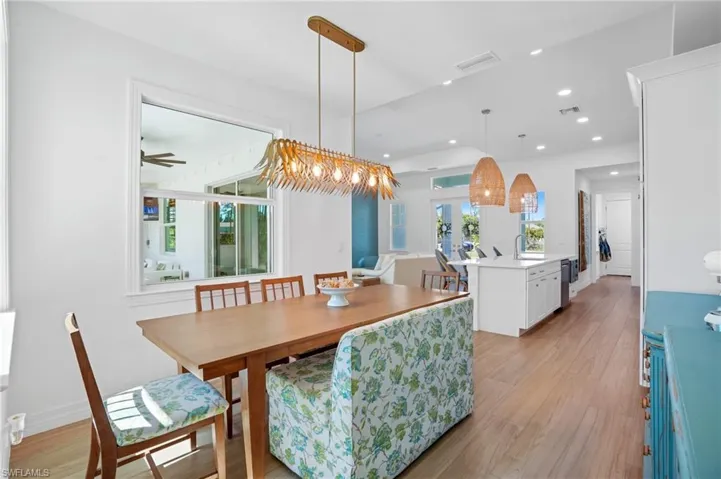 Dining space with recessed lighting, baseboards, visible vents, and light wood finished floors
