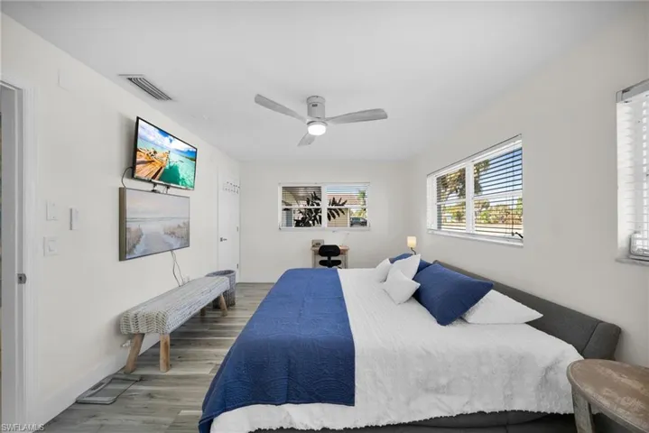 Bedroom featuring a ceiling fan and wood finished floors
