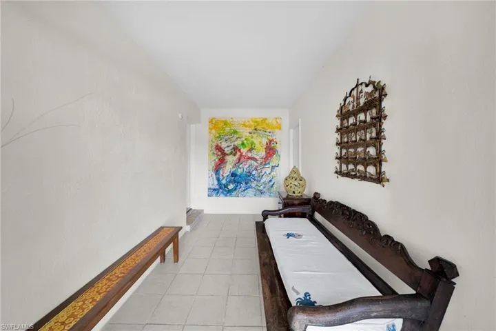 Rec room featuring light tile patterned floors