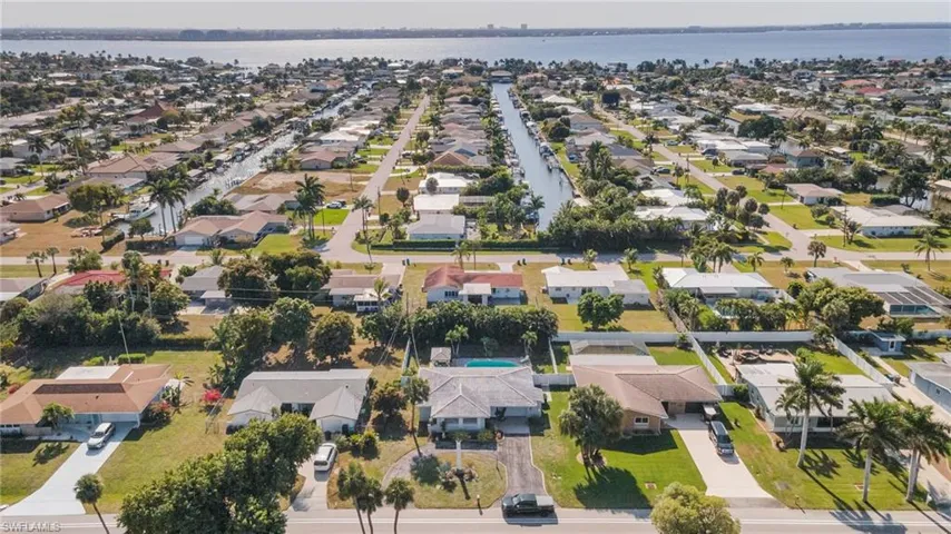 View of property location with nearby suburban area and a large body of water