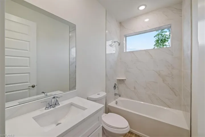 Bathroom featuring bathing tub / shower combination and vanity