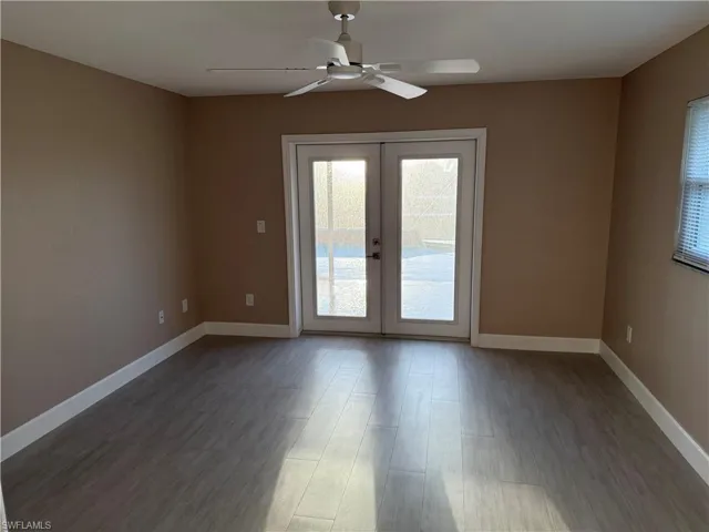 Master Bedroom featuring french doors, ceiling fan, and light wood-type flooring