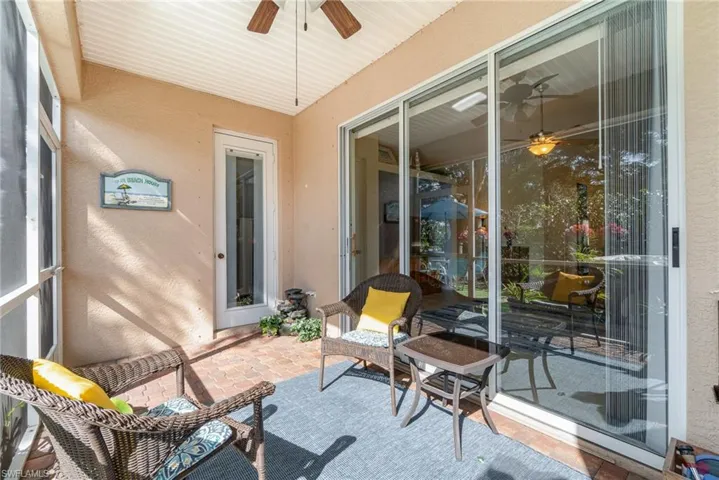 Sunroom featuring a ceiling fan